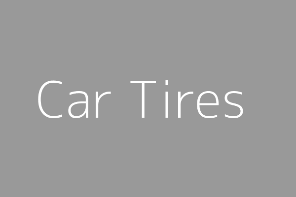 Various car tires stacked