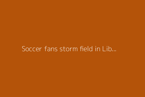 Soccer fans storm field in Libya and a Portuguese referee is injured during a suspended match