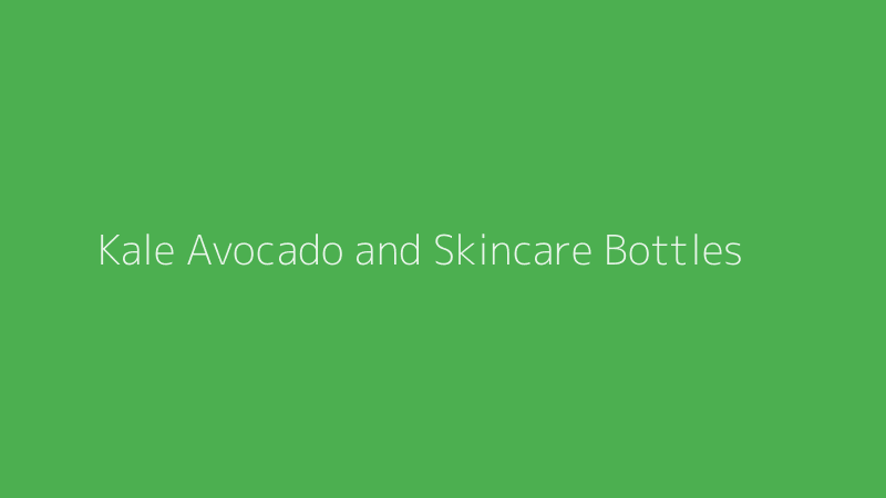 Fresh superfoods like kale and avocado arranged next to luxury skincare serum bottles